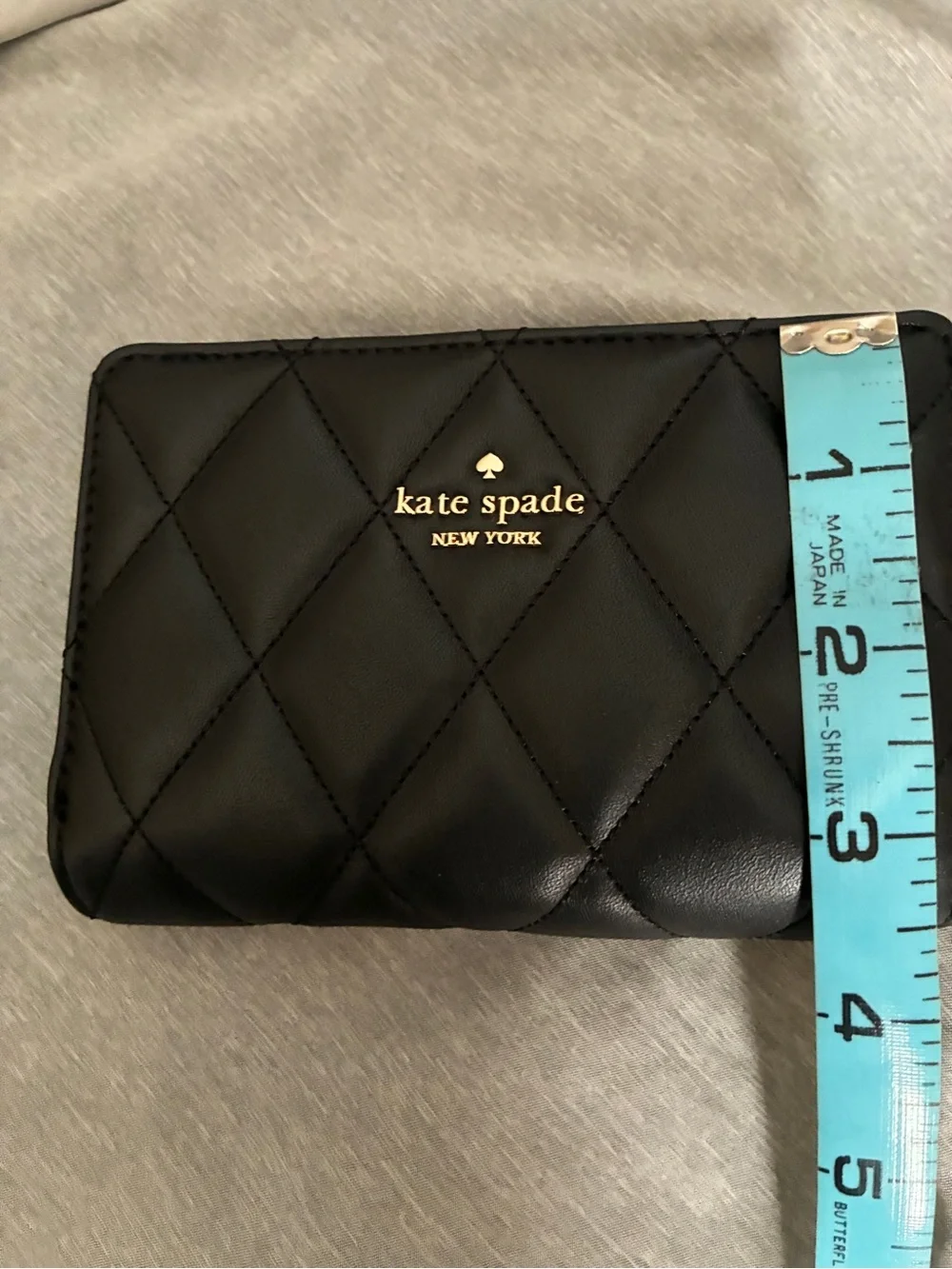 kate spade Medium Black Quilted Leather Zip-Around Wallet with Gold Logo